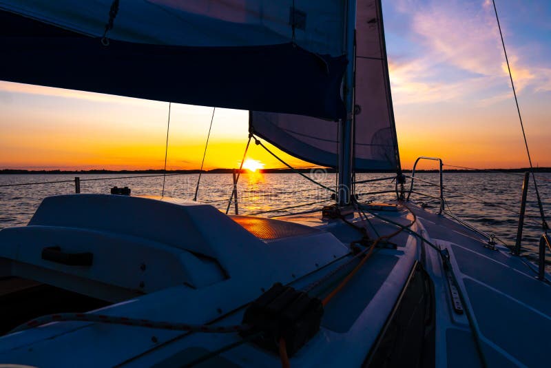 Yacht Sailing in an Open Sea at Sunset. Close-up View of the Deck, Mast ...