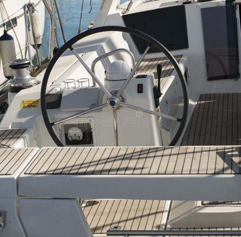 Yacht Steering Wheel on Sunny Day Wallpaper. Water Sport Background