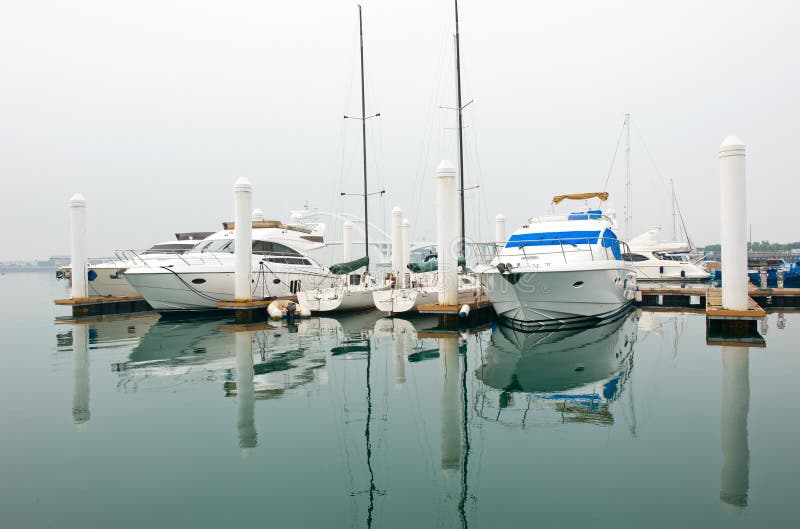 Yachts moored at Marina on a summers day. Yachts moored at Marina on a summers day.