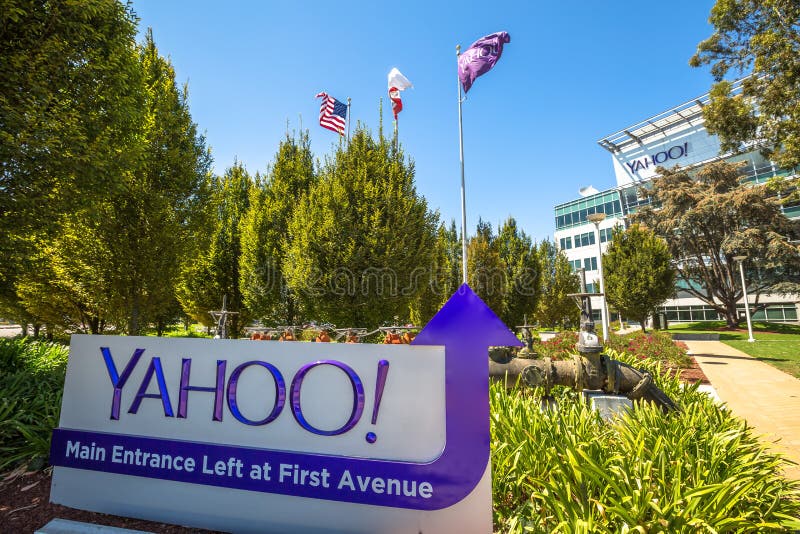 Sunnyvale, California, United States - August 15, 2016: flags in front of Yahoo Headquarters Main Entrance in Sunnyvale with American Flag and flag with Yahoo icon.