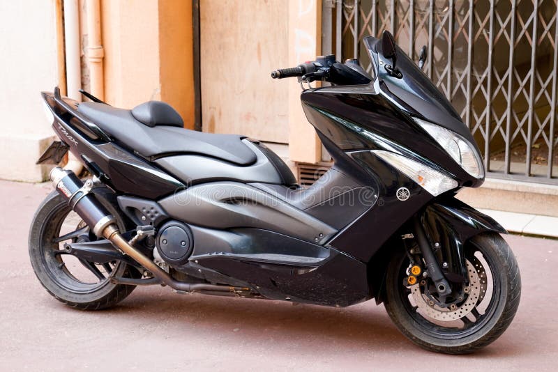 Arcachon , Aquitaine  France - 08 01 2022 : Yamaha t-max maxi-scooters in street manufactured by japan Yamaha Motor Company. Arcachon , Aquitaine  France - 08 01 2022 : Yamaha t-max maxi-scooters in street manufactured by japan Yamaha Motor Company