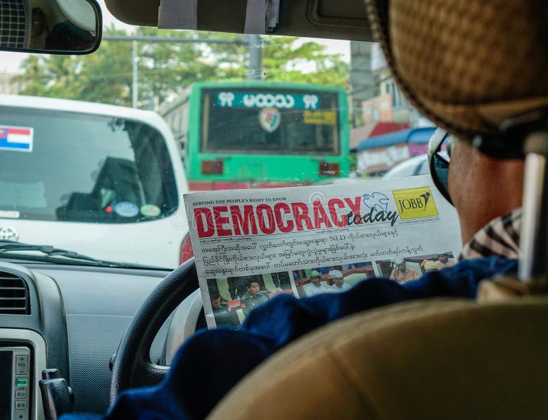 Driver reading news in car