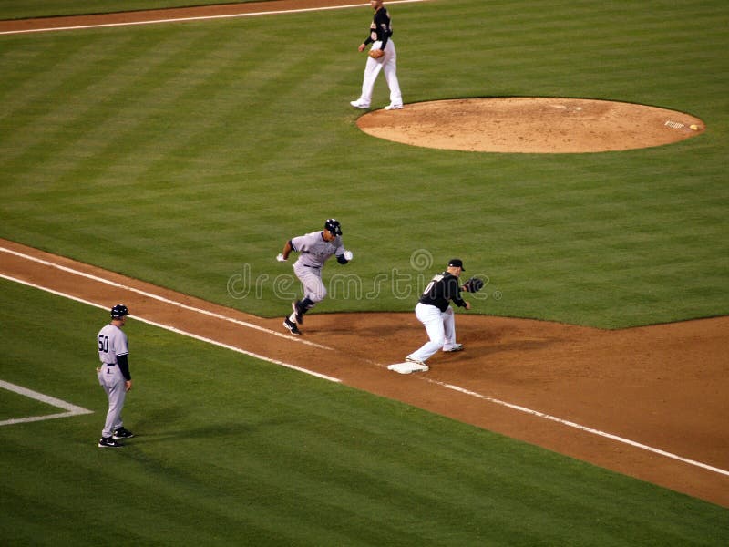 Yankee Alex Rodriguez runs to first base as Oakland A's first ba