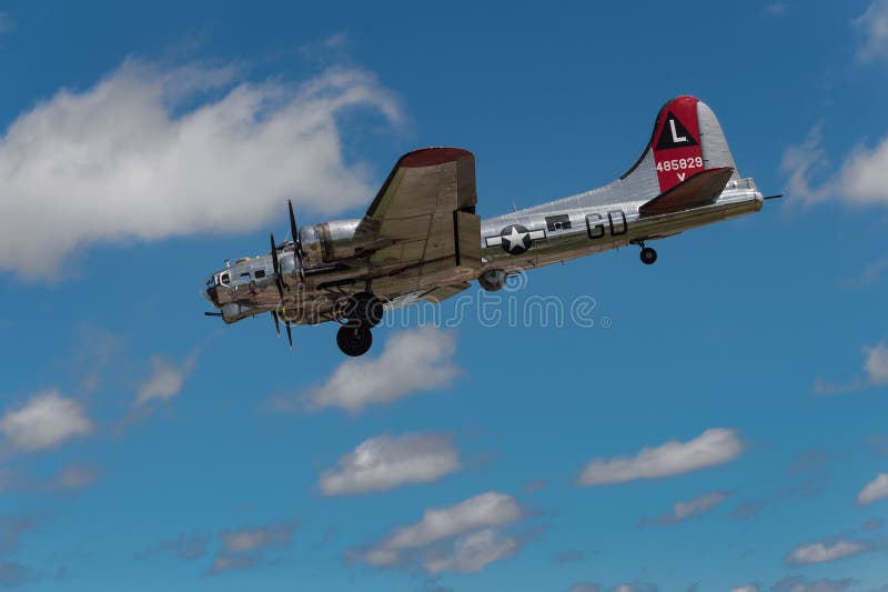 EDEN PRAIRIE, MN - JULY 16 2016: B-17G bomber Yankee Lady comes in for a landing at air show. This B-17 was a Flying Fortress built for use during World War II but never flew in any combat missions. EDEN PRAIRIE, MN - JULY 16 2016: B-17G bomber Yankee Lady comes in for a landing at air show. This B-17 was a Flying Fortress built for use during World War II but never flew in any combat missions.