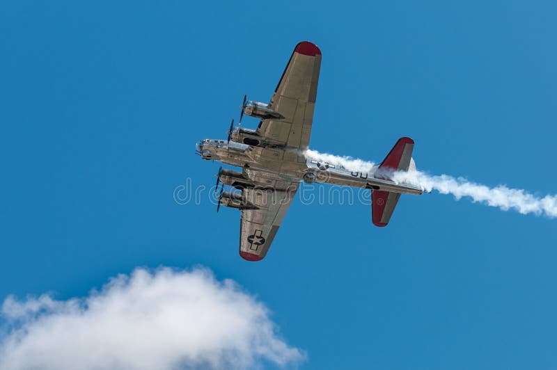 EDEN PRAIRIE, MN - JULY 16 2016: B-17G bomber Yankee Lady flies directly overhead at air show. This B-17 was a Flying Fortress built for use during World War II but never flew in any combat missions. EDEN PRAIRIE, MN - JULY 16 2016: B-17G bomber Yankee Lady flies directly overhead at air show. This B-17 was a Flying Fortress built for use during World War II but never flew in any combat missions.