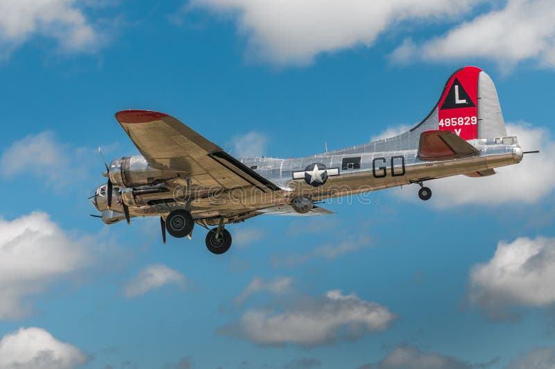 EDEN PRAIRIE, MN - JULY 16 2016: B-17G bomber Yankee Lady preps for a landing at air show. This B-17 was a Flying Fortress built for use during World War II but never flew in any combat missions. EDEN PRAIRIE, MN - JULY 16 2016: B-17G bomber Yankee Lady preps for a landing at air show. This B-17 was a Flying Fortress built for use during World War II but never flew in any combat missions.