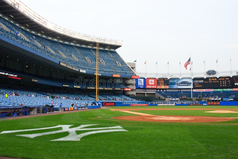 Views from inside the world-famous Yankee Stadium during the final season. It is now closed forever while a new stadium is being built across the street. Field level and the Yankee insignia behind home plate.