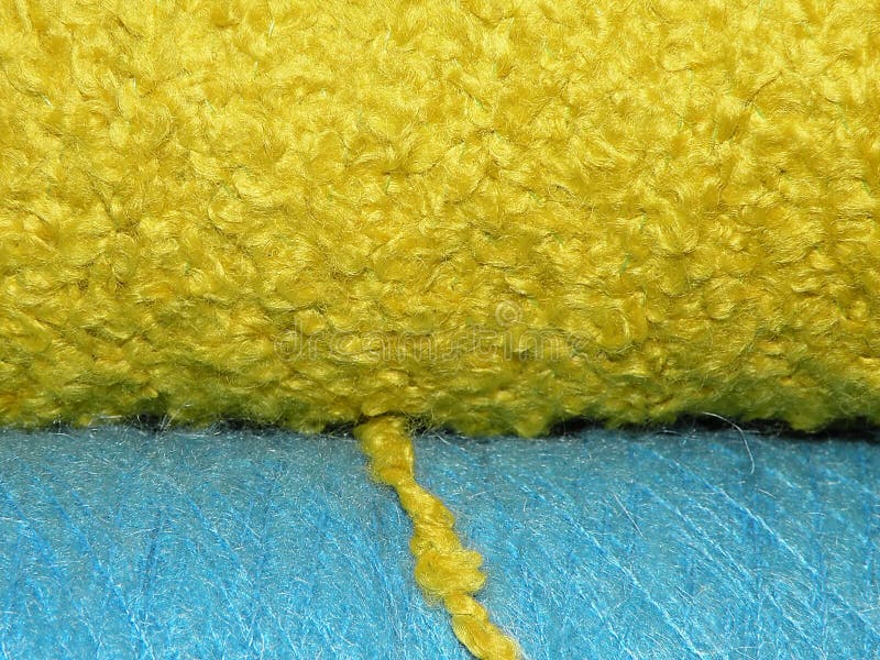 Bright Yellow and Blue Spools of Yarn