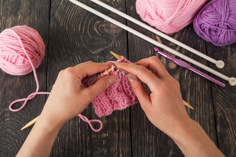 Yarn, Tools for Knitting, Ready Sample in Hands of Master, Against Dark
