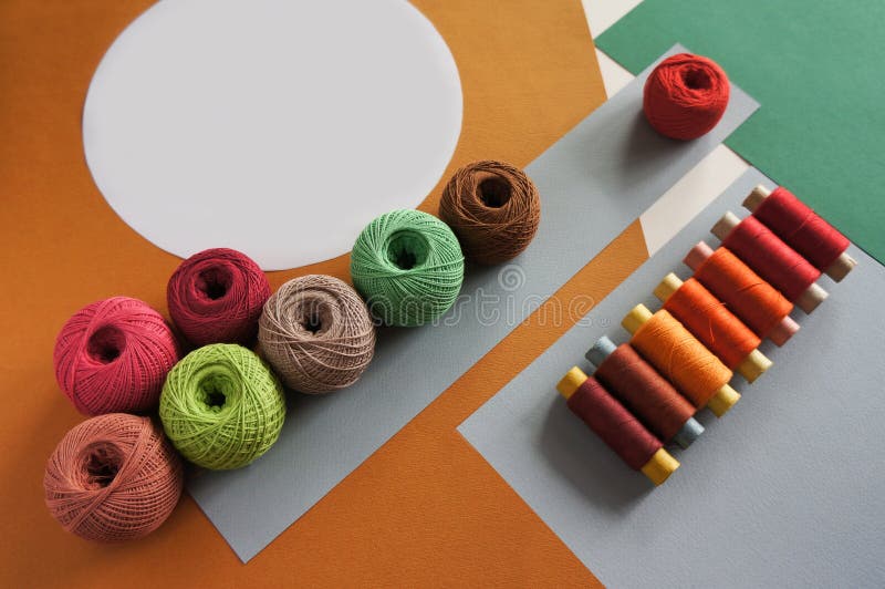 Yarns Of Threads For Knitting In Different Colors On A Yellow And Green