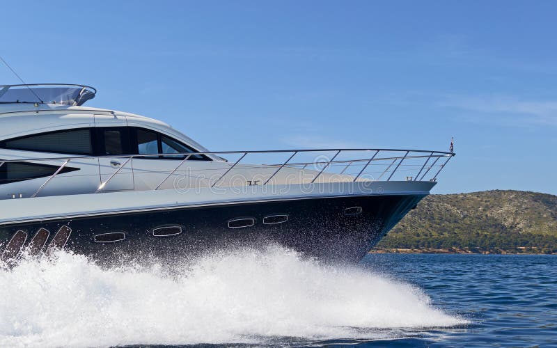 Shot of a luxury motor yacht cruising at full speed. Shot of a luxury motor yacht cruising at full speed.