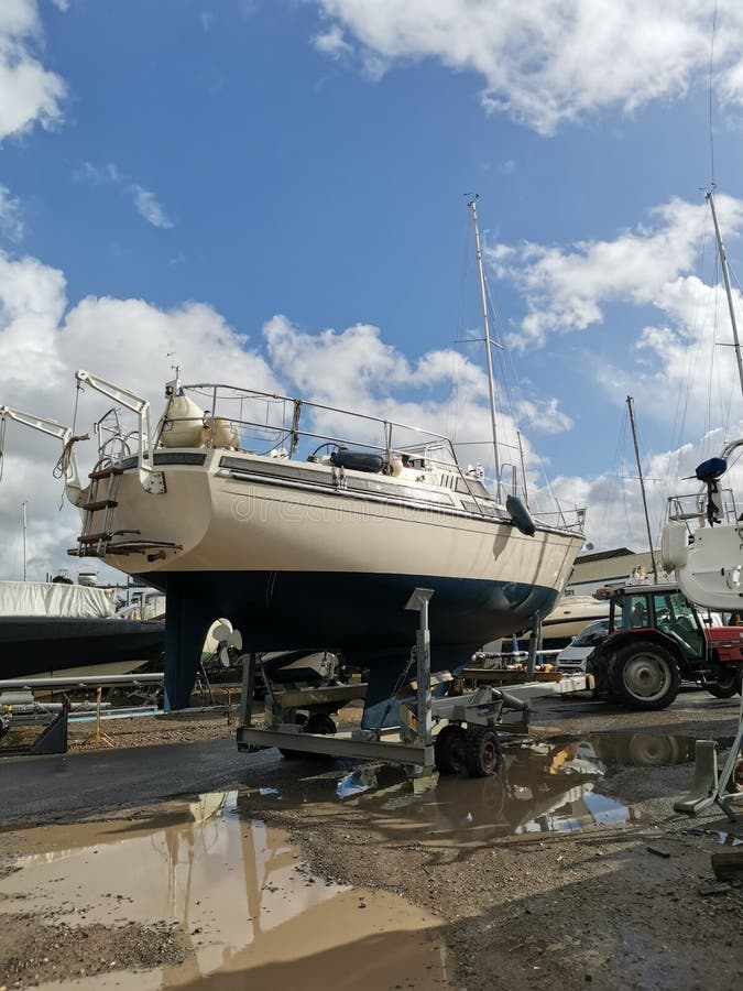 Yacht being craned into water. Yacht being craned into water