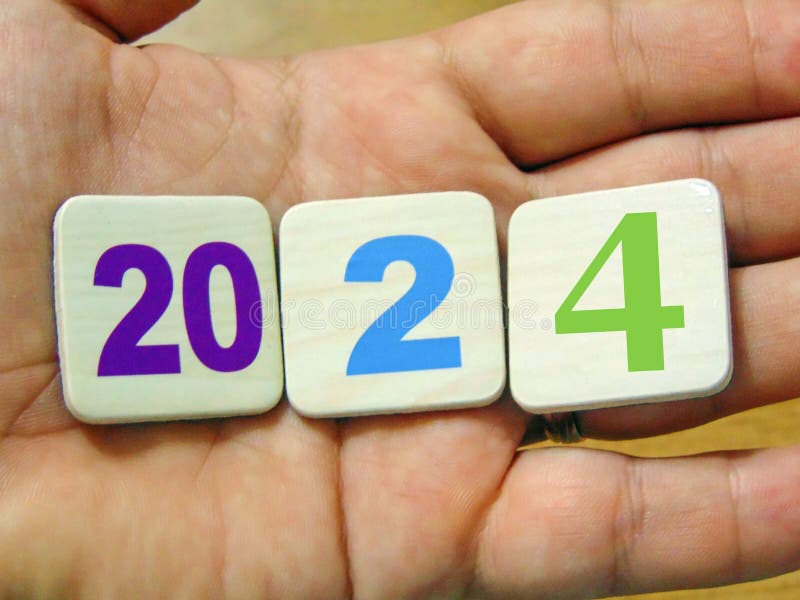 The Year 2024 is Coming. a Person Holds Numbers that Form the Year 2024