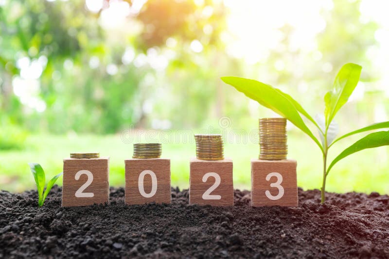 Year 2023 economy growth and recovery, save, invest and grow money concept. Wooden blocks 2023 royalty free stock image