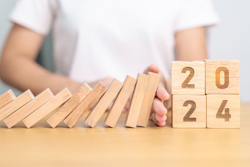 2024 Year with Falling Blocks on Table, Risk Management, Recession