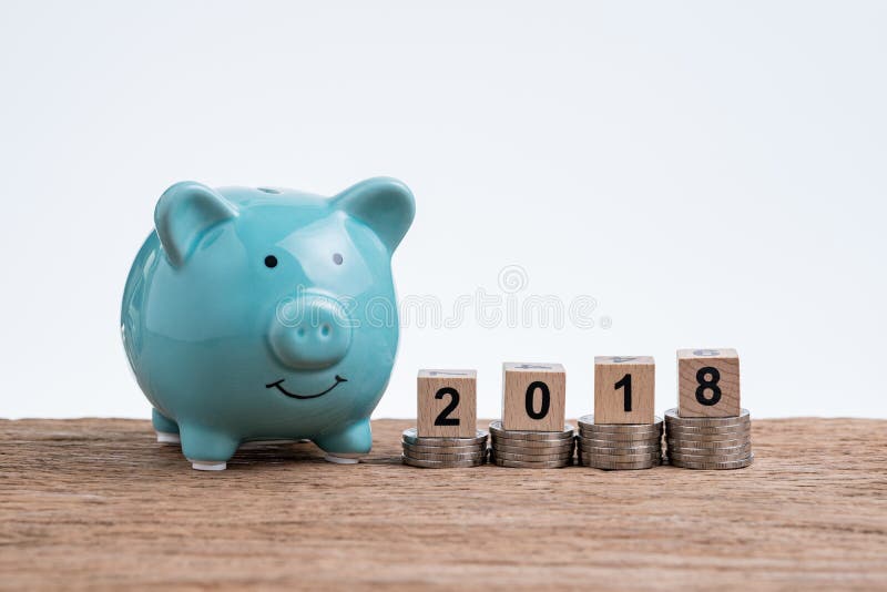 Year 2018 financial plan with piggy bank and coins stacked on to royalty free stock photos Year 2018 financial plan with piggy bank and coins stacked on to royalty free stock photos