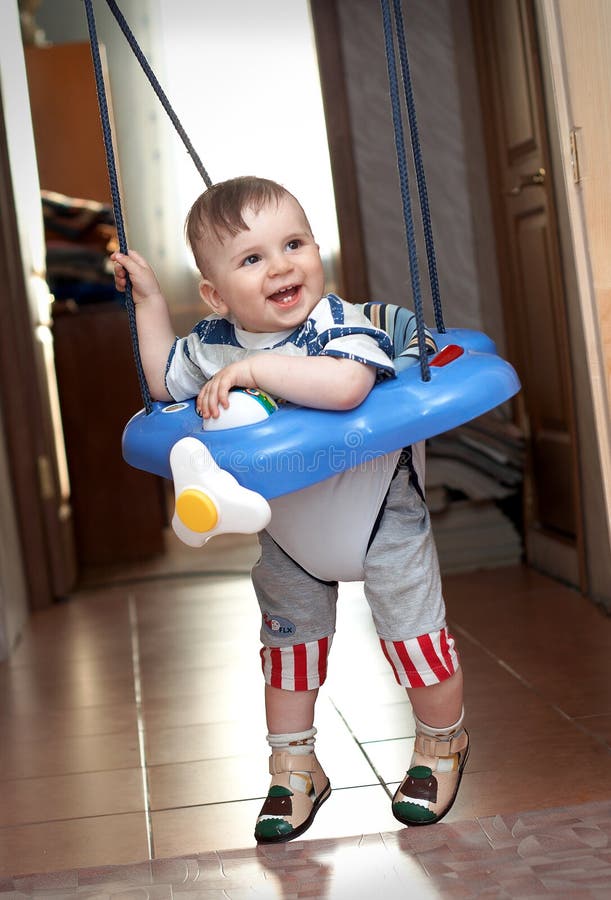 Year-old boy learning to walk