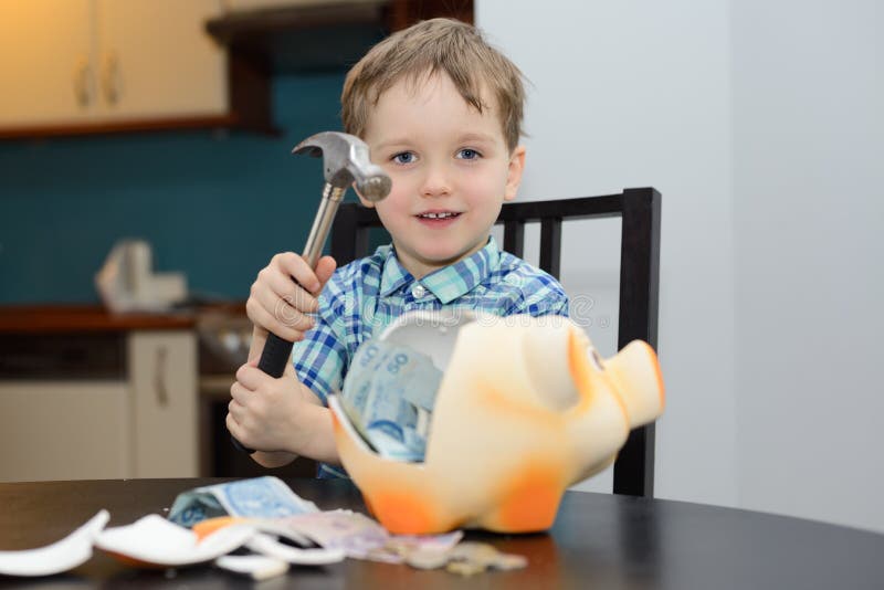 4 year old boy satisfied with breaking the piggy bank royalty free stock photo 4 year old boy satisfied with breaking the piggy bank royalty free stock photo