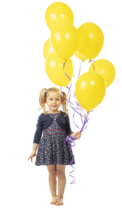 3 year old girl holding a group of yellow balloons