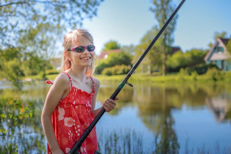 https://thumbs.dreamstime.com/b/year-old-girl-stands-fishing-rod-lake-smiles-wears-red-dress-sunglasses-enjoying-life-girl-118955137.jpg