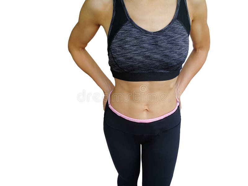 40-year-old housewife with exercise and health care. Girl in exercise  clothes And waist tape measure Sports bra and exercise pants. The girl in  the body fit and firm. Stock Photo