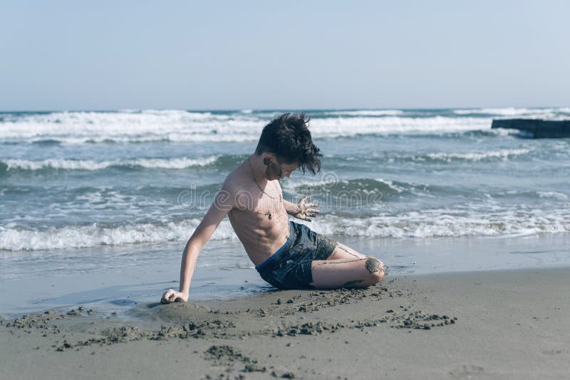 Teen Boy Lies and Sunbathes on the Beach Stock Image - Image of malaysia,  head: 133945289