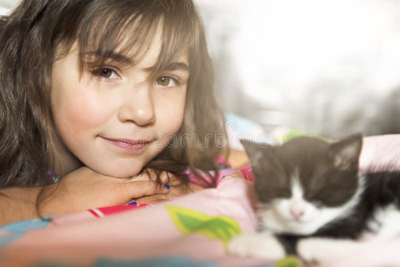 7 Years Old Girl with Kitten at Home Bed Stock Photo Image of hair