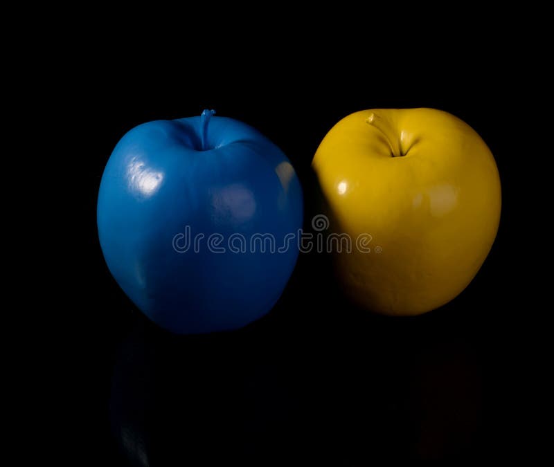 Yellow apple and blue apple.