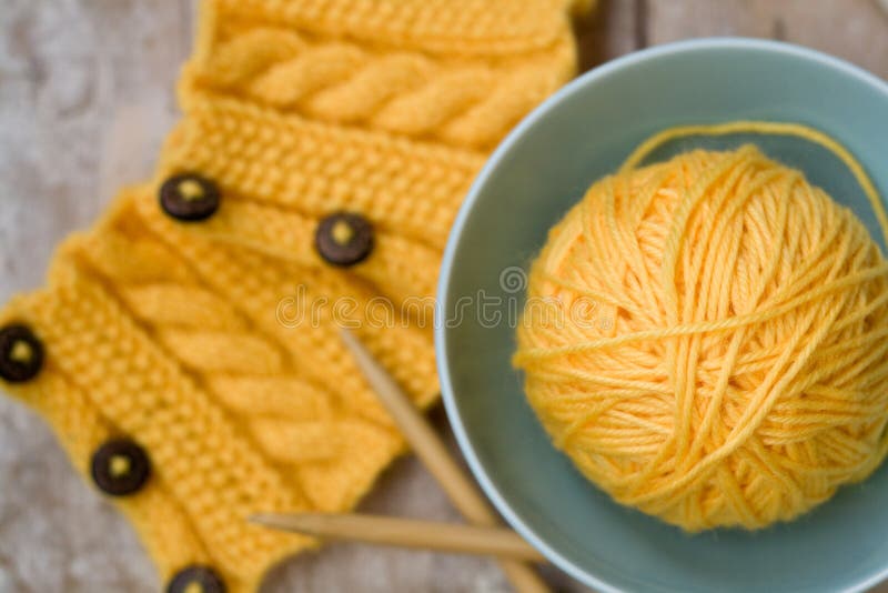 Yellow Ball of Yarn for Knitting in Blue Plate Stock Image Image of