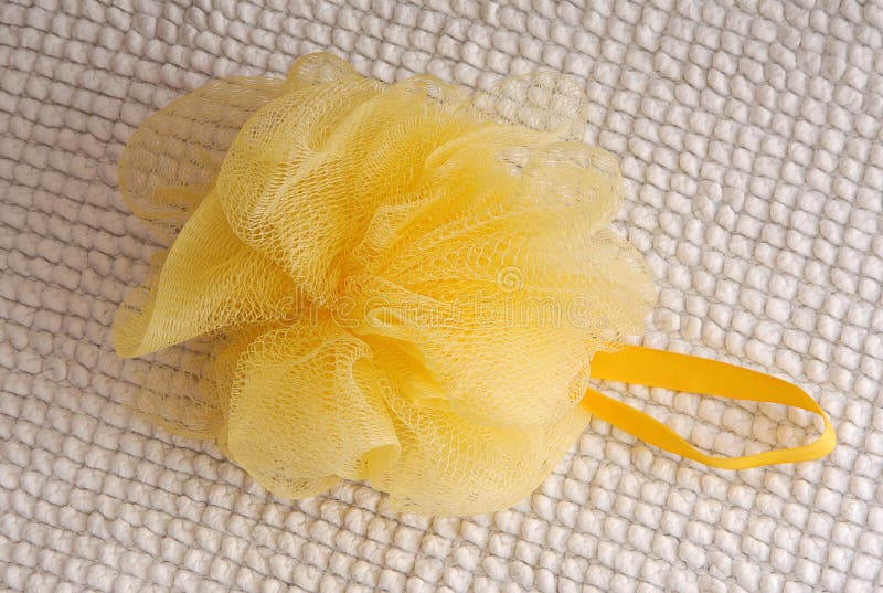 Yellow bath sponge stock photo. Image of washcloth, white 77574202