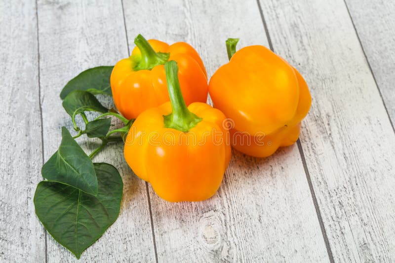 Yellow Bell Pepper with Leaves Stock Photo Image of background