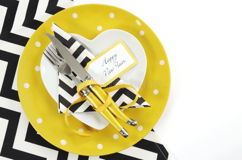 Yellow black and white theme Happy New Year table setting