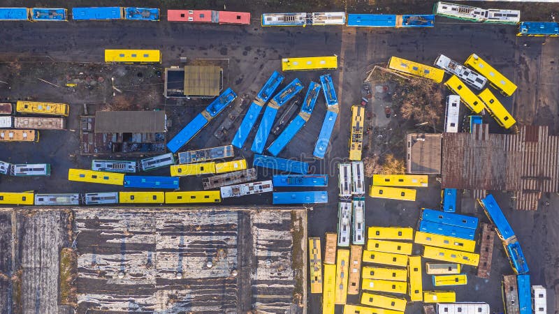 Yellow and blue buses and cars aerial top view. abandoned transport parking. stock photo