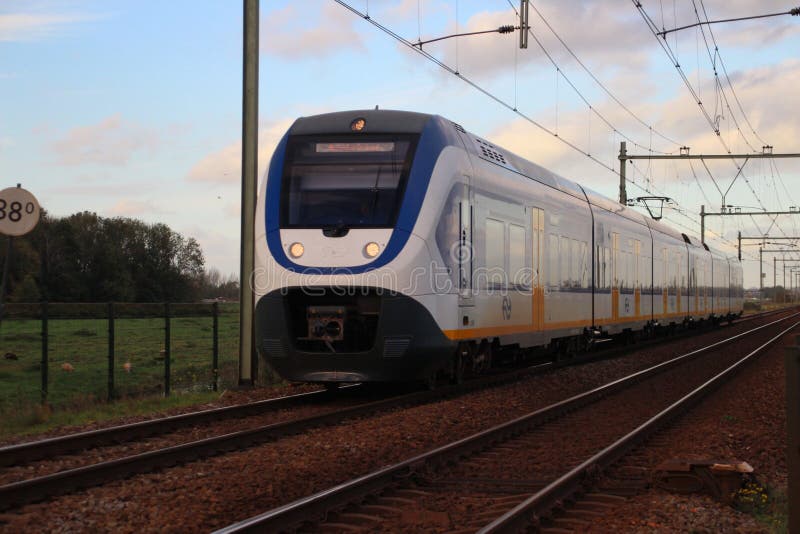 Yellow blue train type SLT sprinter of dutch Railways NS on the train bridge of Gouda in the Netherlands royalty free stock images Yellow blue train type SLT sprinter of dutch Railways NS on the train bridge of Gouda in the Netherlands royalty free stock images