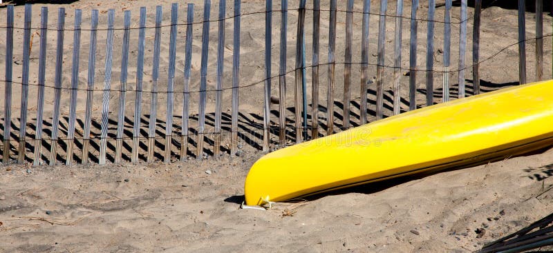 Yellow Boat in the Sand stock photos