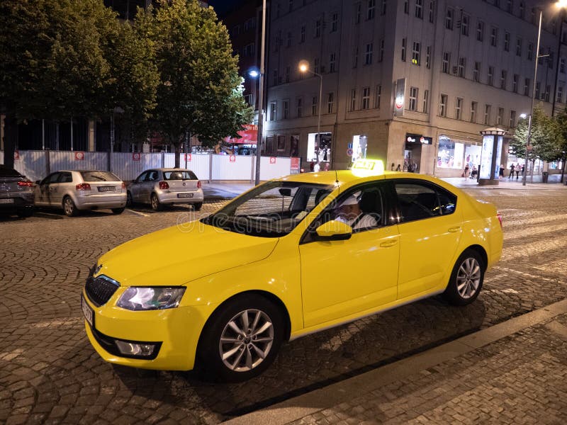 Yellow Cab or Taxi on Wenceslas Square at Night in Prague stock image Yellow Cab or Taxi on Wenceslas Square at Night in Prague stock image