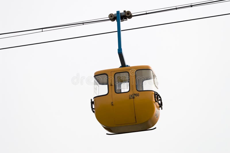 Yellow cable car hanging