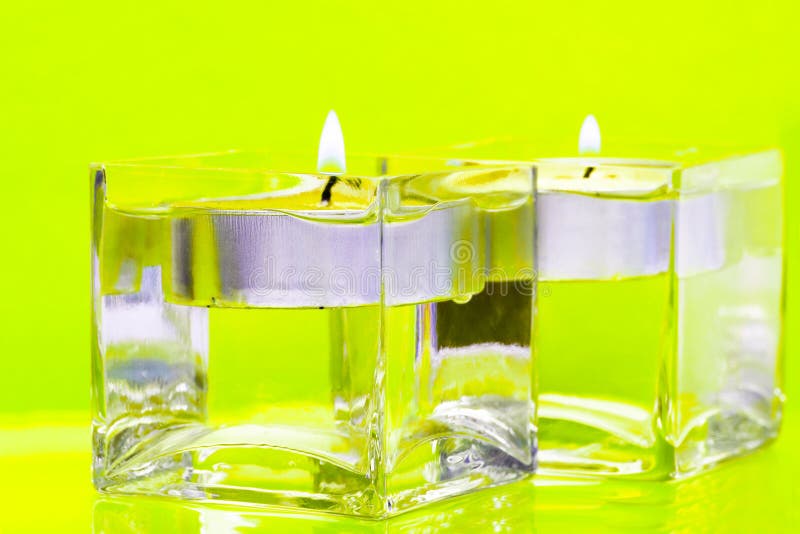 Yellow candles in glass stock photo. Image of decorate 7685216
