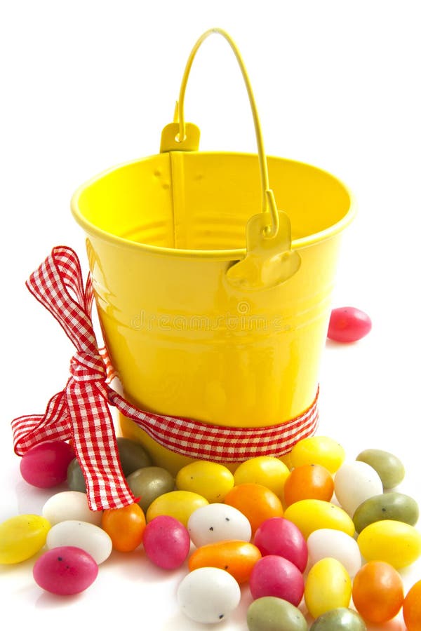 Yellow candy bucket stock image. Image of group, spots 18733625