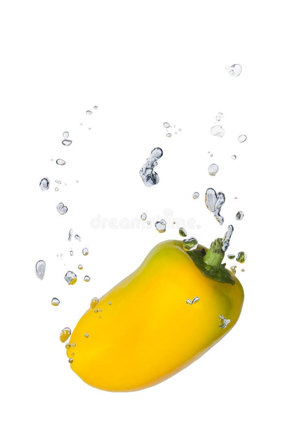 Yellow capsicum in water with air bubbles stock photos