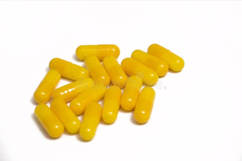 Yellow vitamin capsules stock image. Image of treatment 13148665