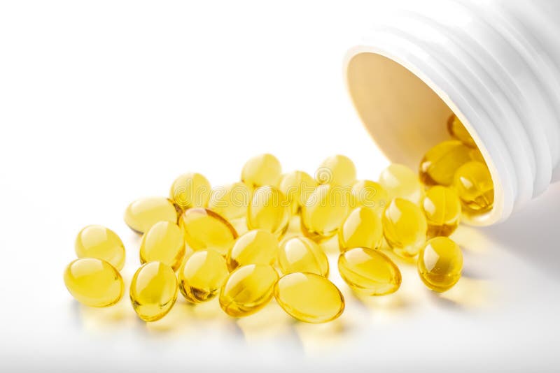 Yellow capsules omega 3, fatty acid, fish oil and bottle, on white background