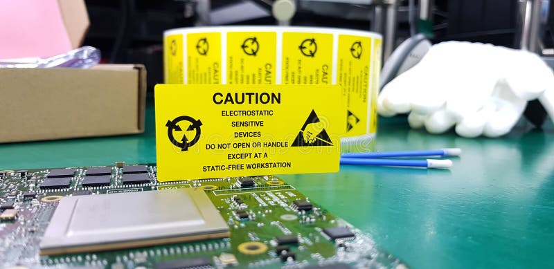 The yellow CAUTION label for Electrostatic Sensitive Devices ESD on static free workstation