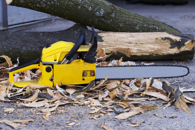 Yellow chainsaw stock photo. Image of yellow, work, white 17509412