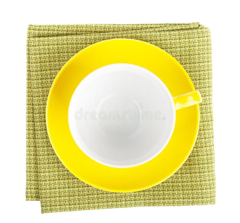 Yellow coffee cup over kitchen towel