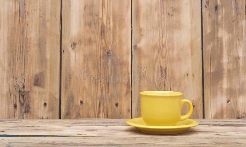 Yellow coffee cup and saucer