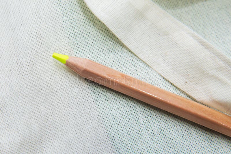 Yellow colored pencil One single object, top view, bright tint. Yellow color pencil on white background. Top surface brown pencil. Top surface brown pencil stock photography Yellow colored pencil One single object, top view, bright tint. Yellow color pencil on white background. Top surface brown pencil. Top surface brown pencil stock photography