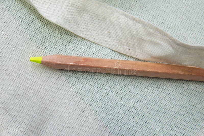 Yellow colored pencil One single object, top view, bright tint. Yellow color pencil on white background. Top surface brown pencil. Top surface brown pencil stock photo Yellow colored pencil One single object, top view, bright tint. Yellow color pencil on white background. Top surface brown pencil. Top surface brown pencil stock photo