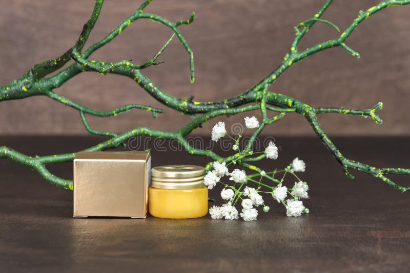 Download Yellow Cosmetic Glass Jar With Moisturizer Balm Cream And Gold Color Cardboard Box On A Wooden Background With Flowers And Branch Stock Image Image Of Flower Hygiene 173579679 Yellowimages Mockups