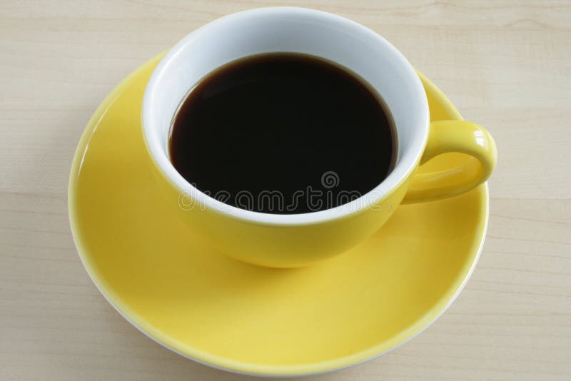 Yellow cup of coffee stock image. Image of afternoon 49602201